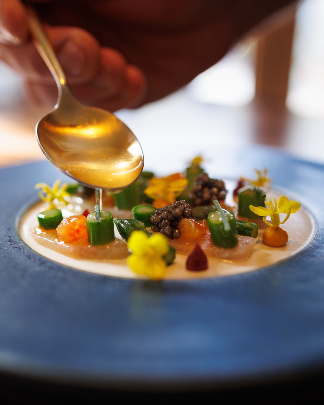 A signature caviar course, finished tableside